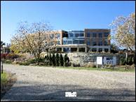 A building with trees in front of it

Description automatically generated with low confidence