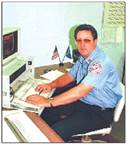 A person sitting at a desk

Description automatically generated with medium confidence