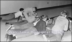A group of people lying on the floor

Description automatically generated with low confidence