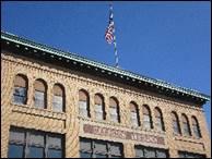 A building with a flag on top

Description automatically generated with medium confidence