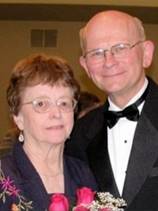 A person and person posing for a photo

Description automatically generated with medium confidence