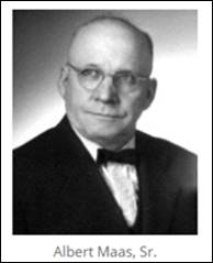 A person wearing glasses and a suit

Description automatically generated with low confidence