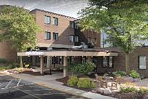 A picture containing building, outdoor, tree, road

Description automatically generated
