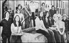 A group of people posing for a photo

Description automatically generated
